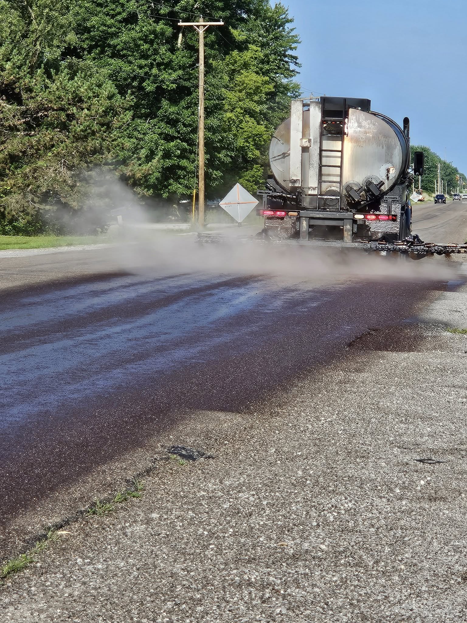Chip and sealing a road